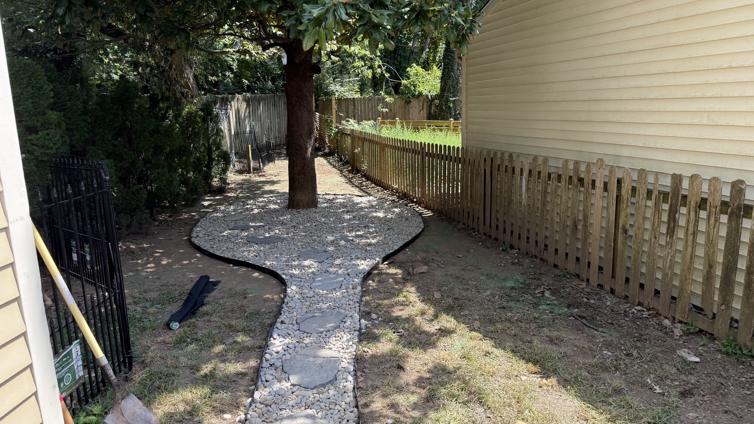 Completed river rock landscaping and walkway