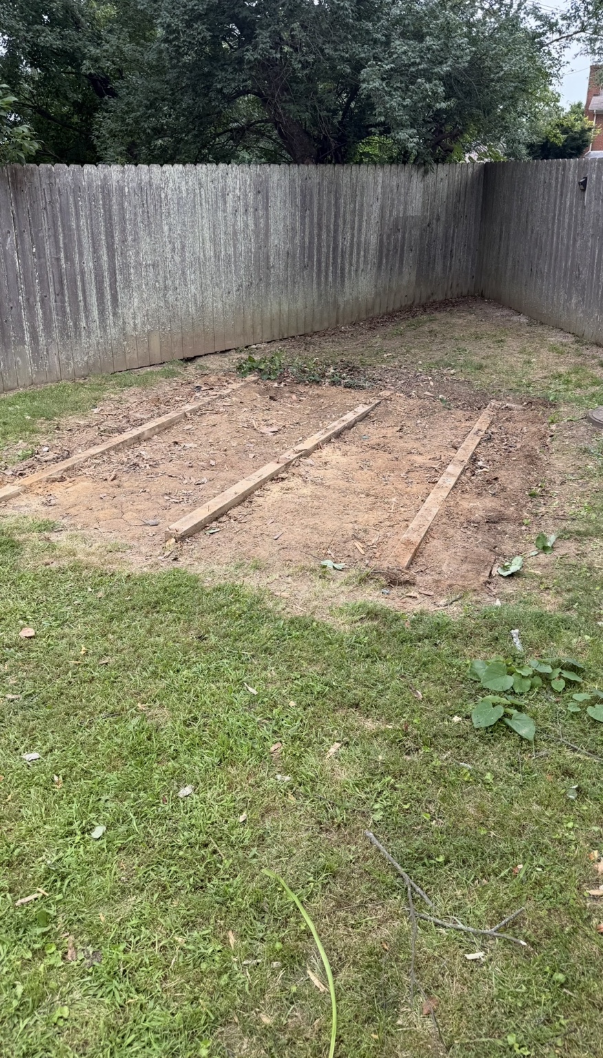 Backyard before gravel shed pad installation